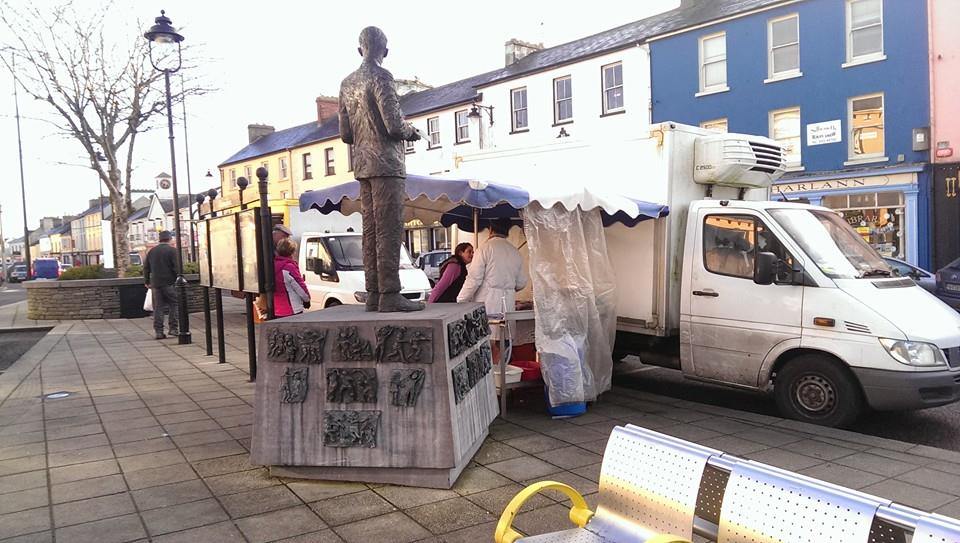 Dunmanway Farmers Market - Set up around statue of Sam Maguire