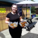 Rosscarbery Traditional Fish and Chips - Waitress with two portions of food