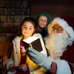 Child and Santa spellbound by Magical Book - Santa’s Magical Market, Marina Market in Cork