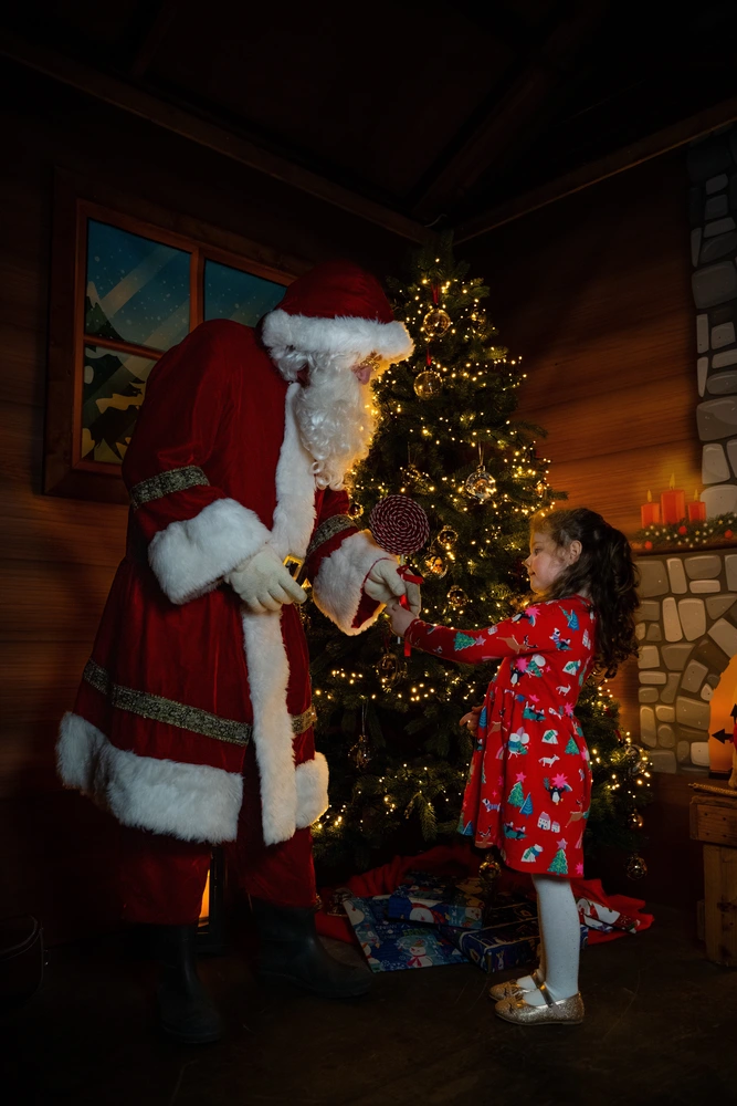 Young girl pictured with Santa Claus - Santa‘s Magical Market Launch